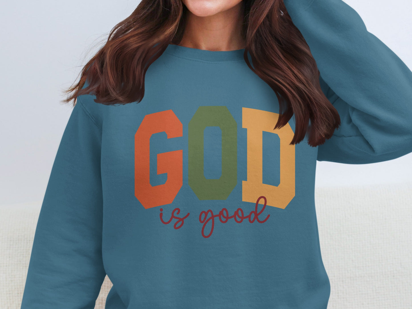 GOD is good sweatshirt in bold multicolored text